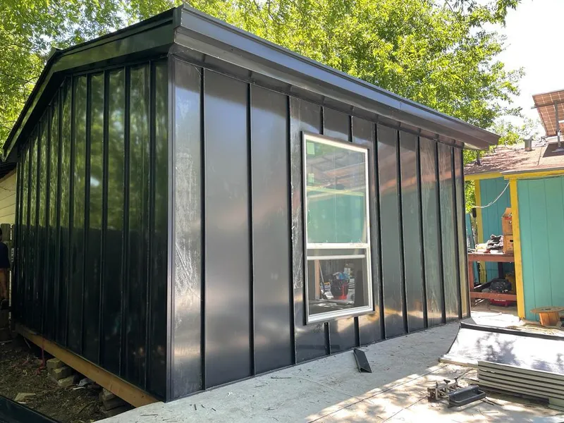 Black standing seam metal wall panels for Roof Inspection in East Grand Forks