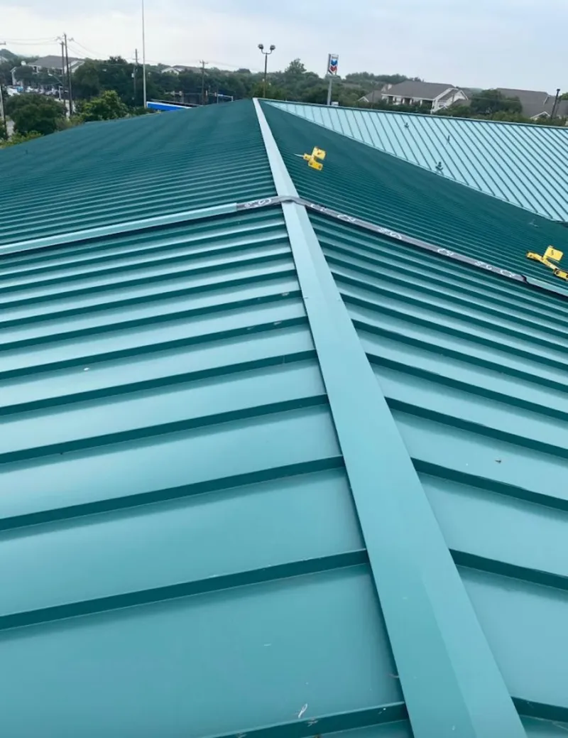 Green commercial metal roof ridge and valley for Metal Roof Repair in East Grand Forks